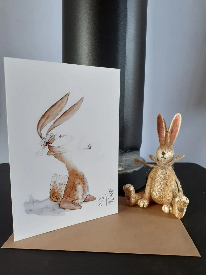 Card with a rabbit holding a ring