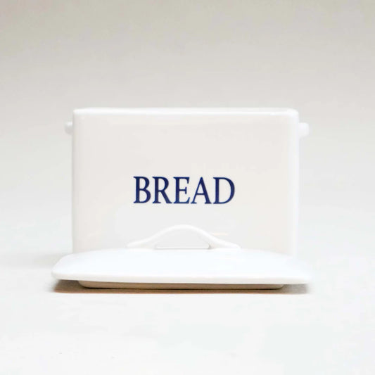 Mini white bread bin with classic design, styled for kitchen or home storage