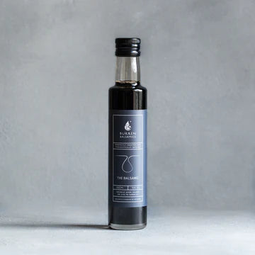 Jar of Balsamic Vinegar against a grey background