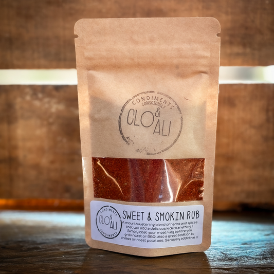 Packaging of Clo and Ali Seasonings, showing the product through a transparent window, with a label that reads 'Sweet & Smoky Rub'.