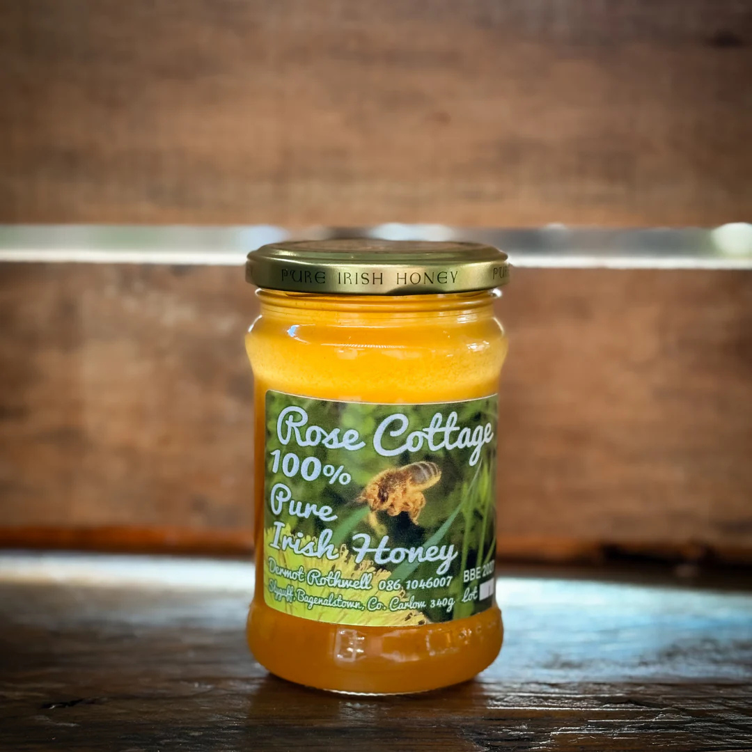 Jar of Honey against  wooden background