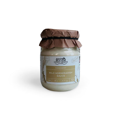 Jar of mild horseradish sauce with a brown paper cover on a white background