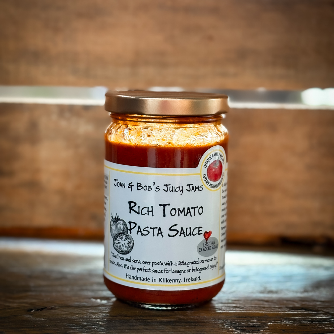 Jar of sauce against a wooden background