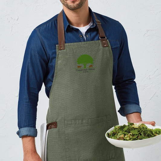 Man wearing a coppenagh house farm apron
