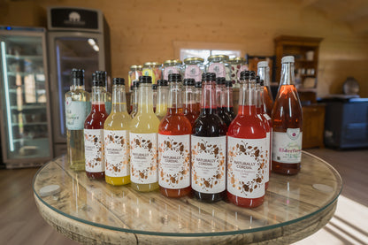 Naturally Cordial bottles against a shop background