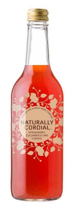 Bottle of cordial against a bleck and grey checkered background