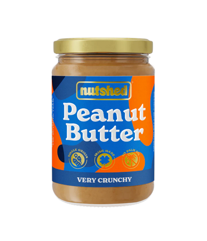 Jar of peanut butter against a black and grey checkered background