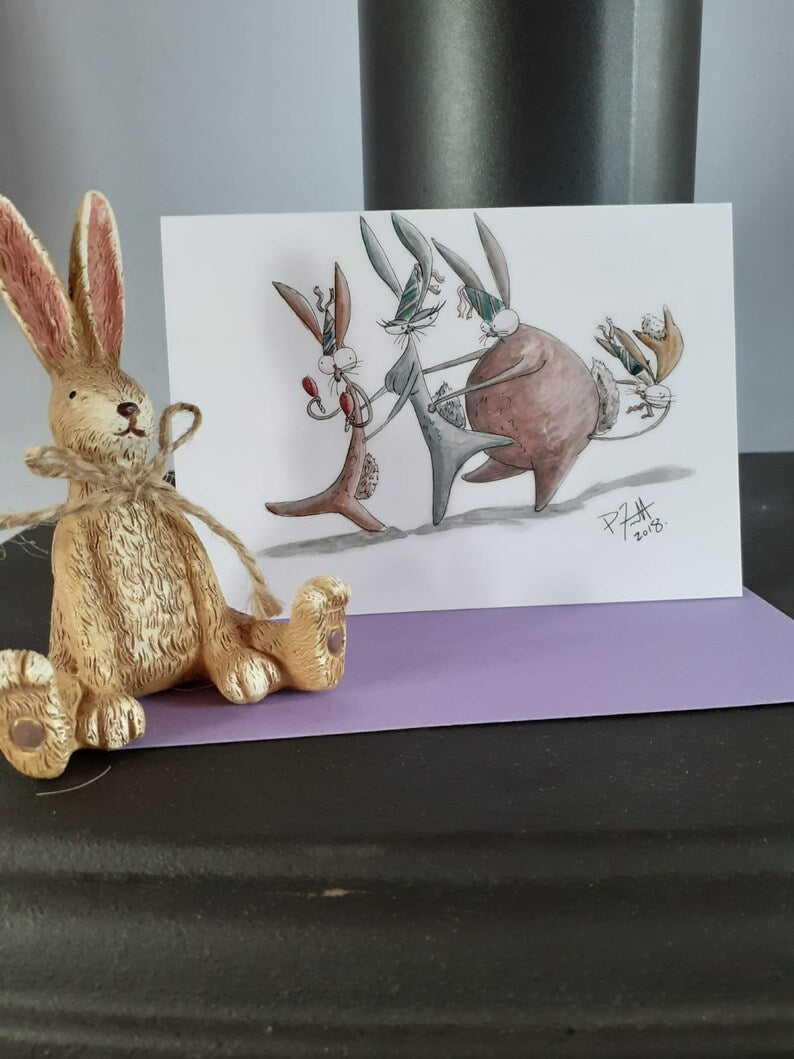 Card with rabbits in a conga line