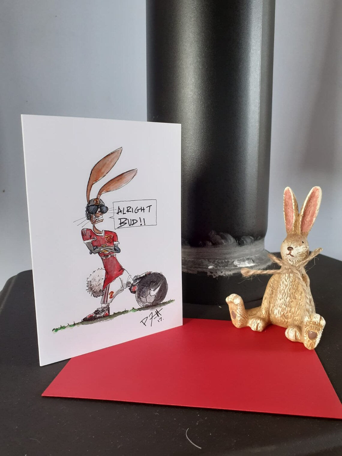 Card with a rabbit wearing Manchester United football gear