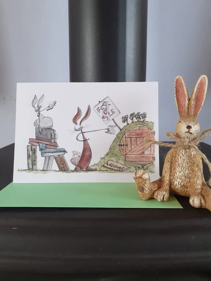 Card with a rabbit buying his new burrow