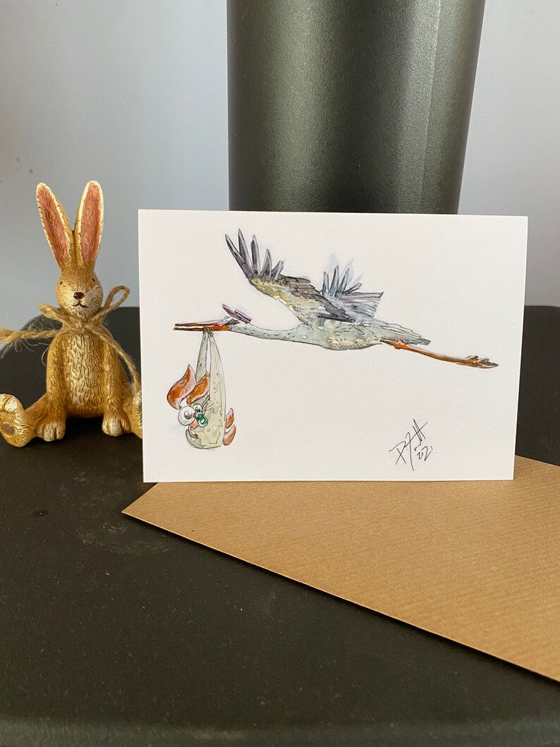 Card with a stork carrying a baby rabbit